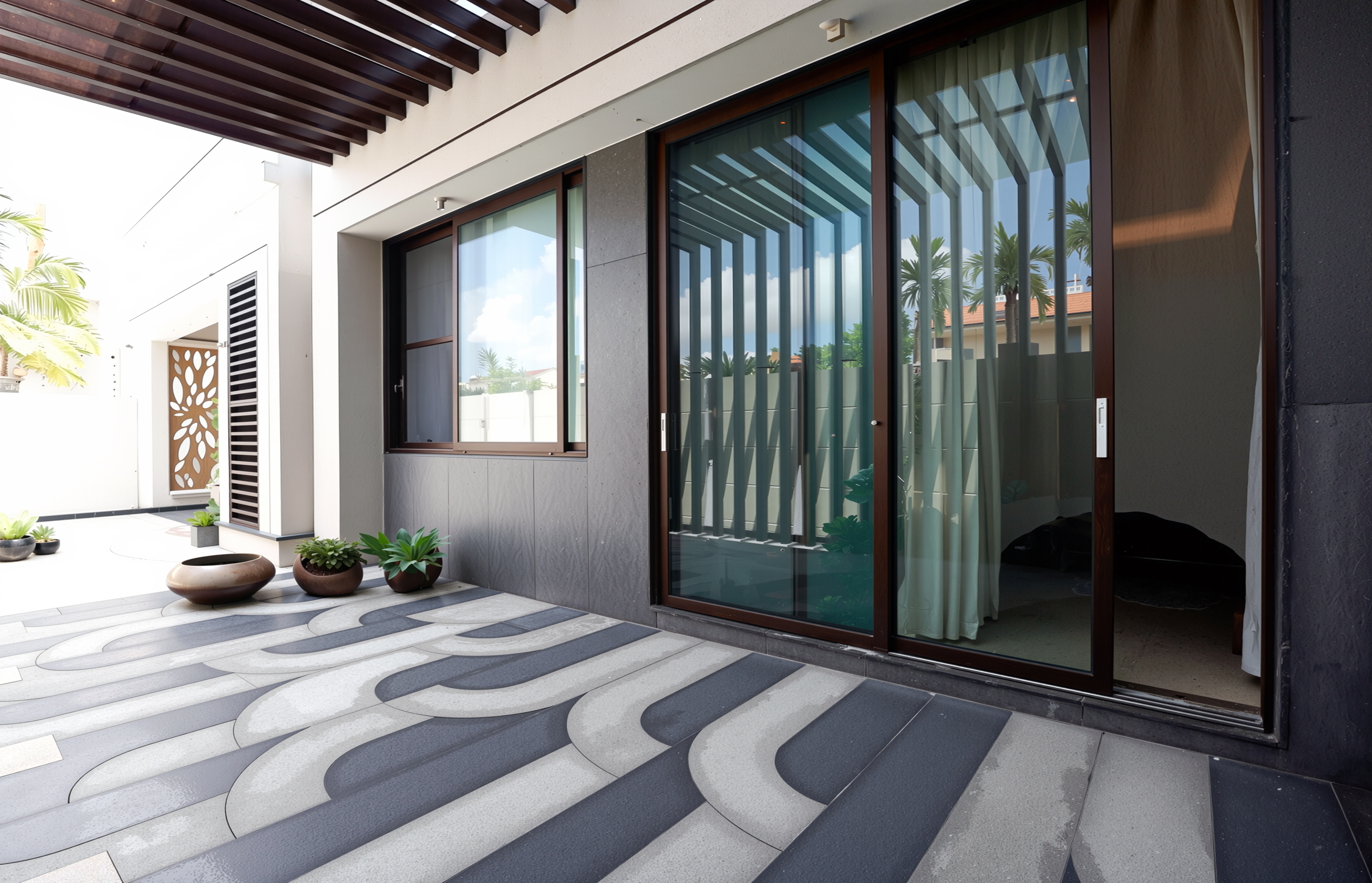 Luxury villa interior with expansive floor-to-ceiling sliding glass doors opening to a serene pool and garden — aspirational residential living